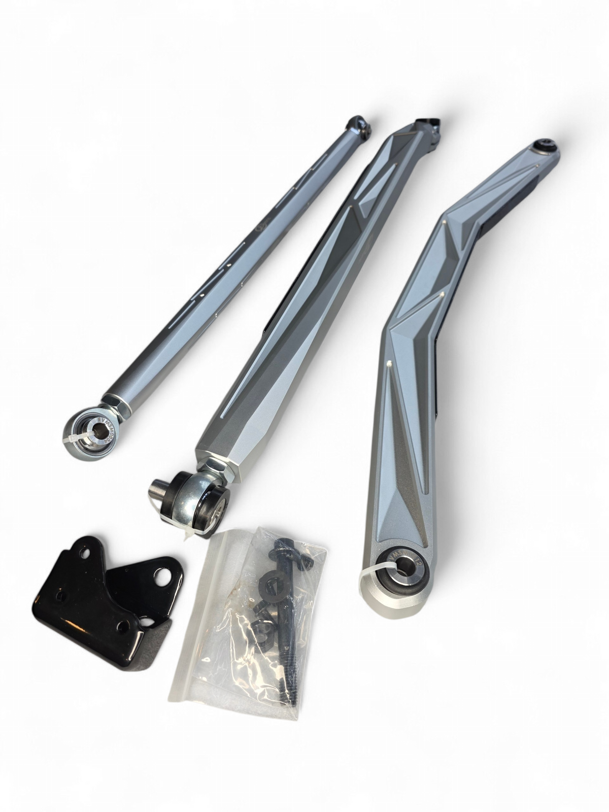 Brush shield removed from Can-Am Maverick R radius rod showing exposed Heim joint and mild steel satin black powder coated plate