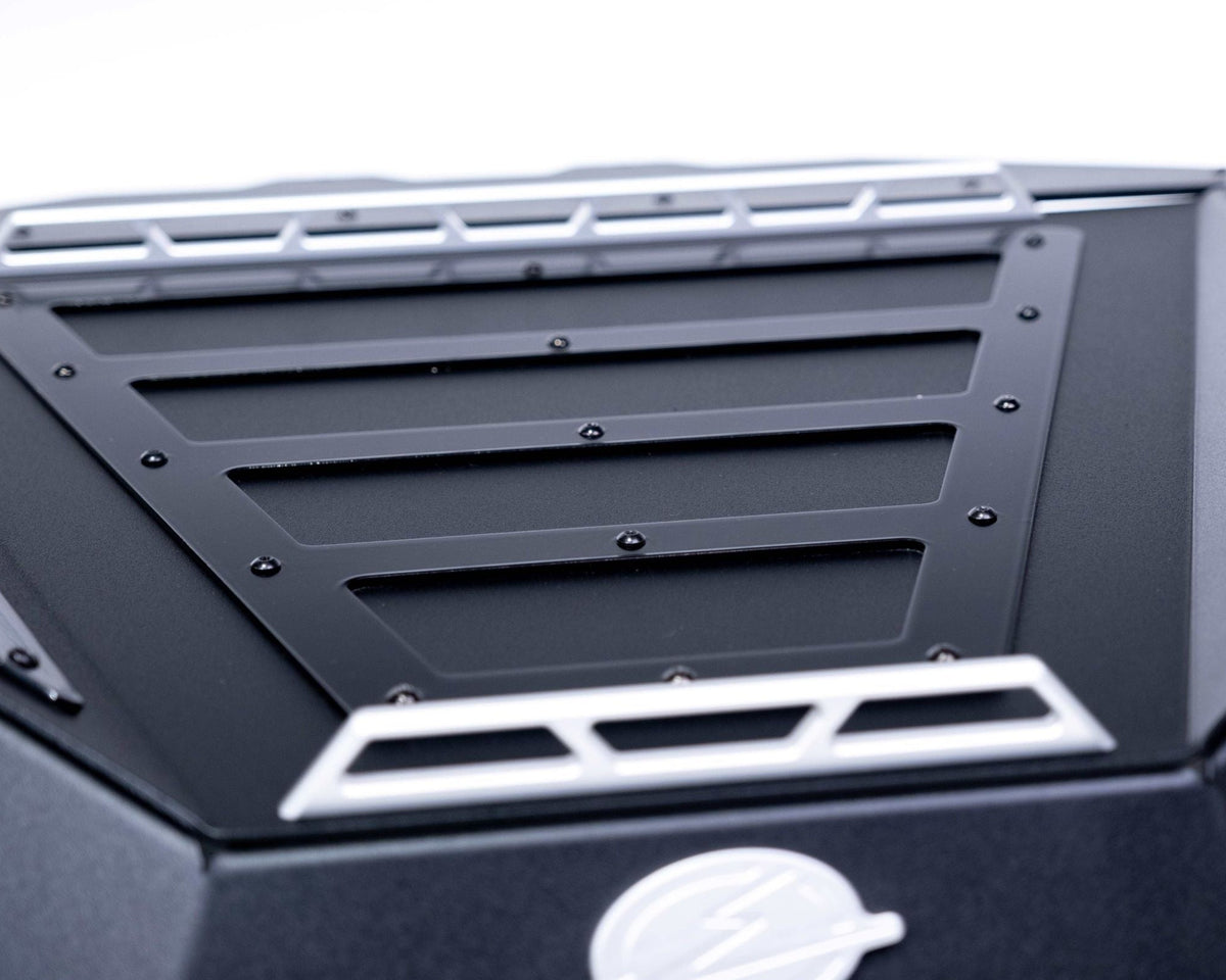 Gear strapped to tie-down rails on top of Polaris RZR Baja bed box lid