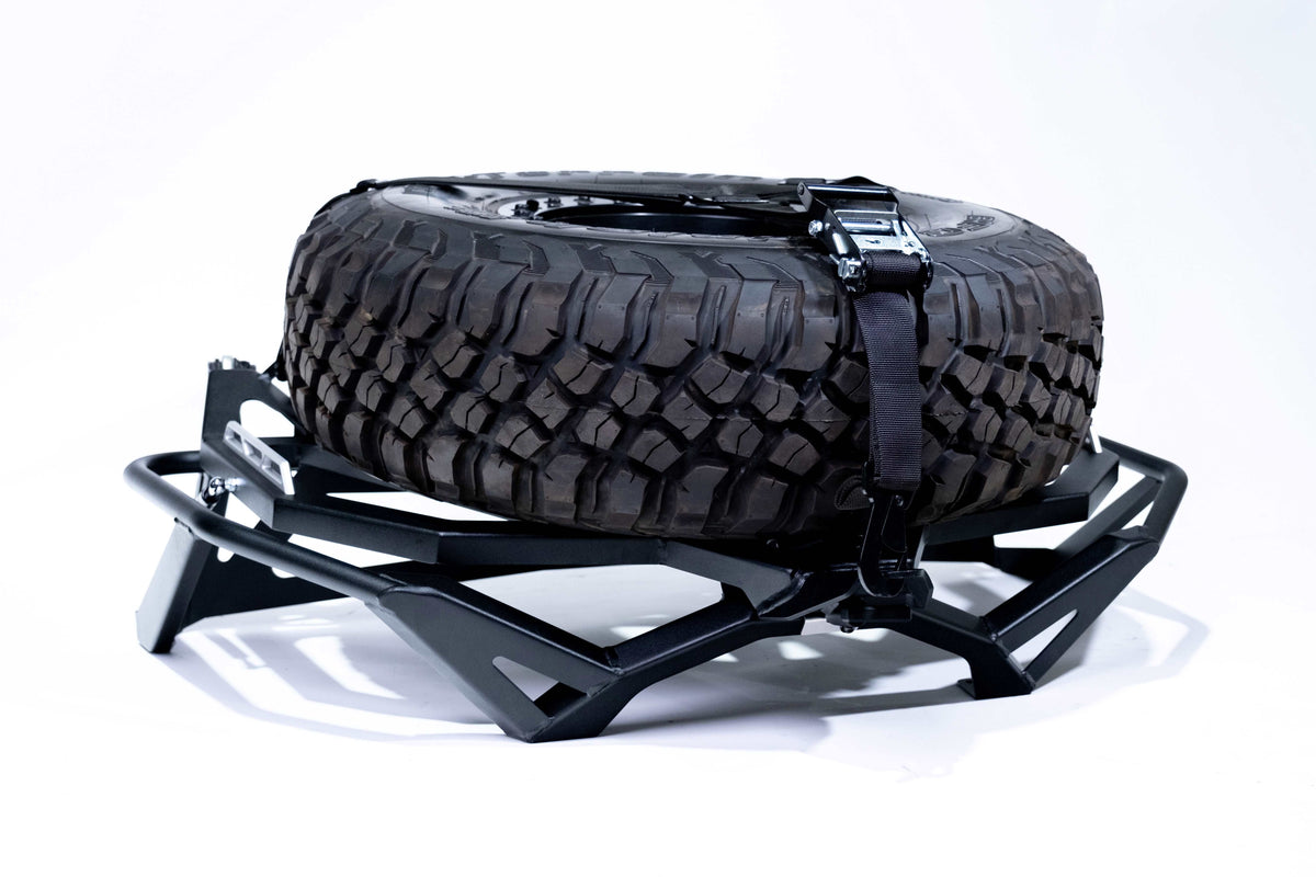 Tool storage compartment open on Can-Am Maverick X3 Volt Series Baja tire rack