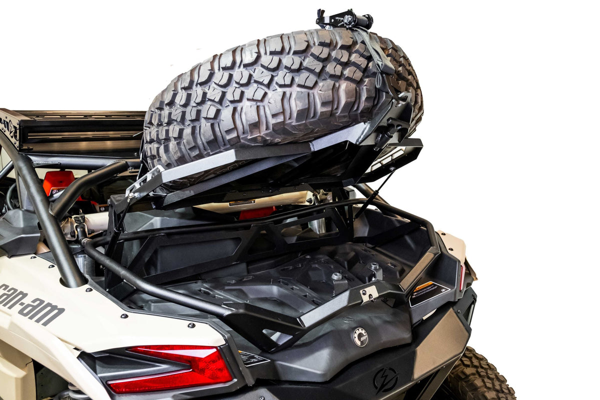 Hidden storage area beneath spare tire on Can-Am Maverick X3 Volt Series Baja rack