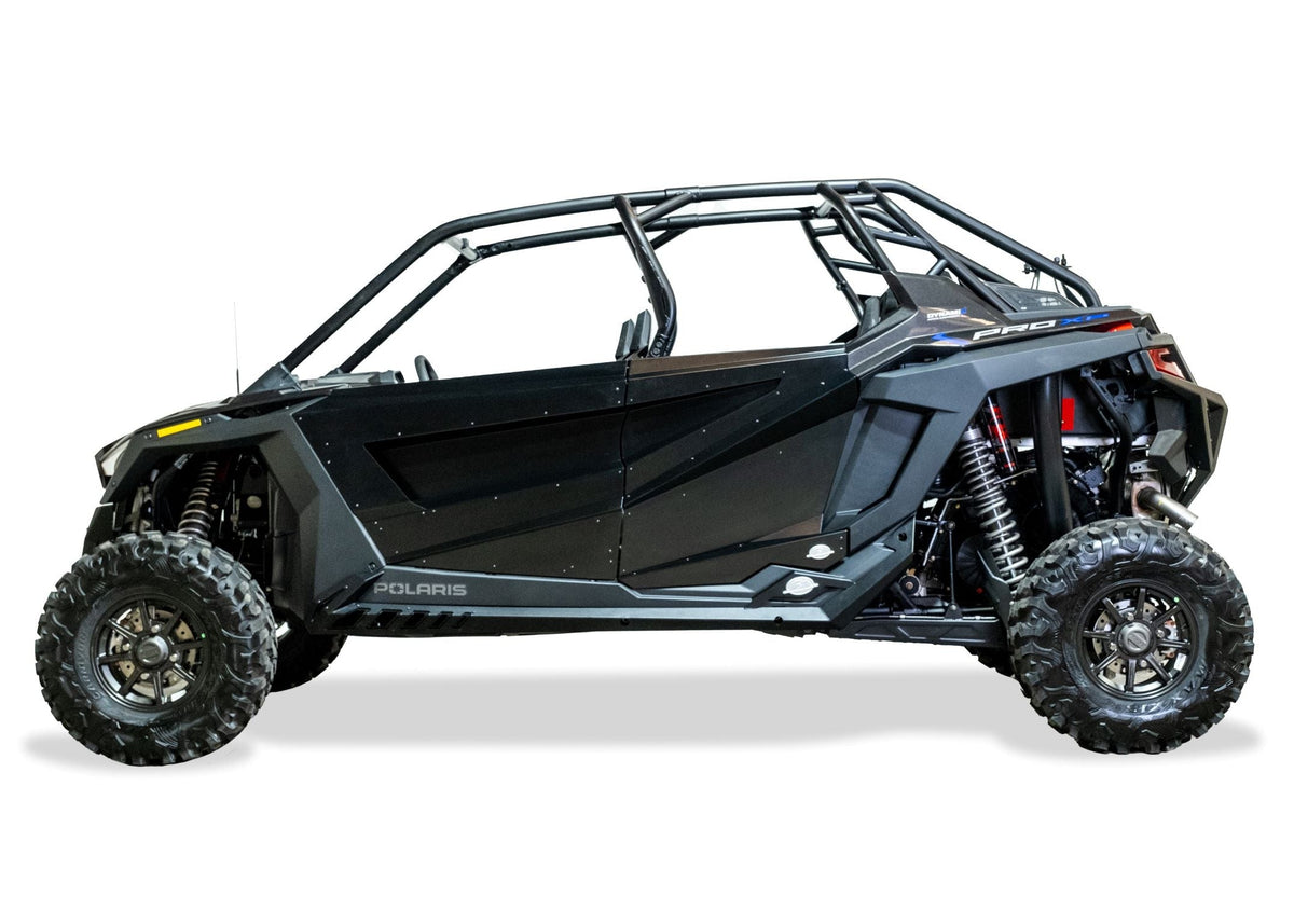 Full side view of 4-seat Polaris RZR with Volt Series rock sliders