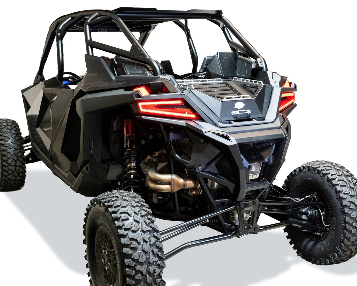 Billet aluminum tie-down rails on top of Polaris RZR Baja bed box lid