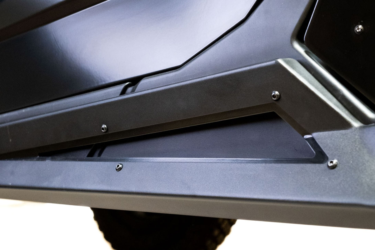 Satin black aluminum accent plate detail on Can-Am Maverick X3 Volt Series Rock Sliders