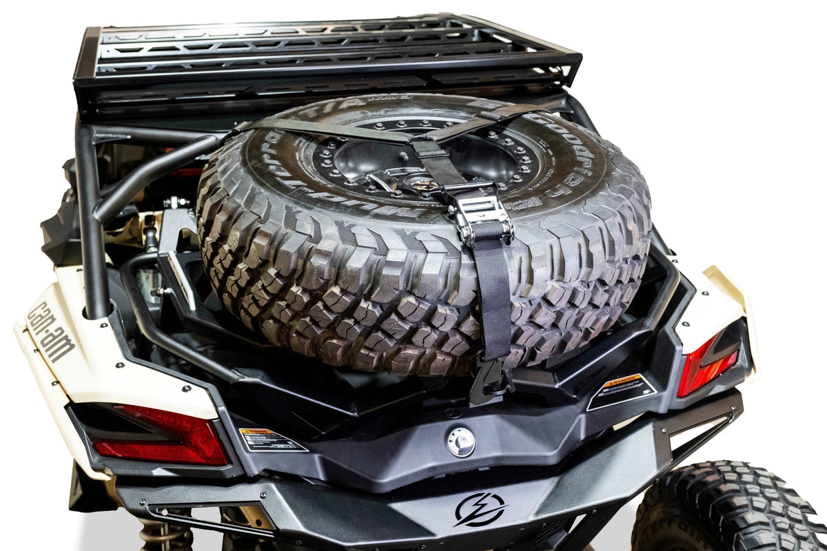 Hold down mount and Y strap detail securing spare tire on Can-Am Maverick X3 Baja rack