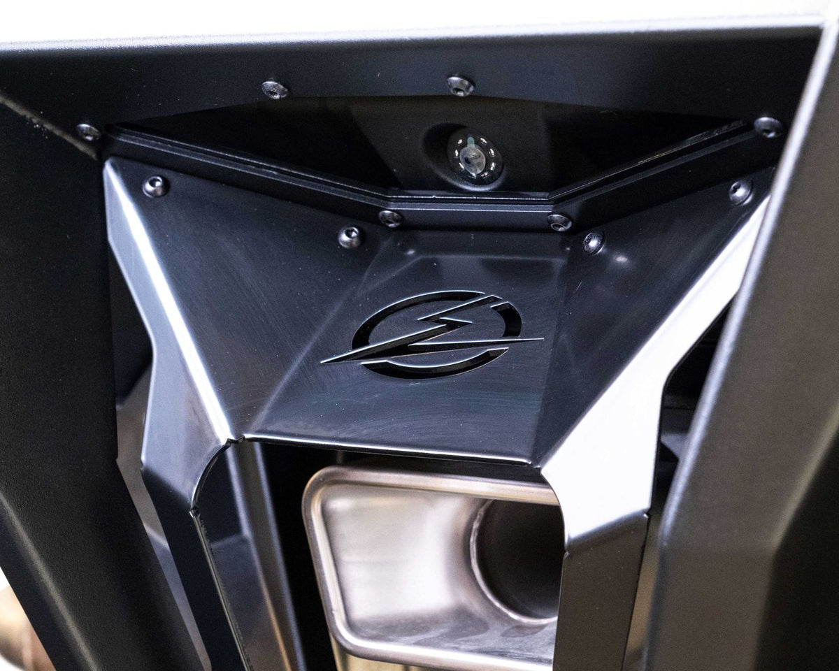 Bolt-on mounting bracket on Polaris RZR Pro R rear bumper showing radius rod clearance