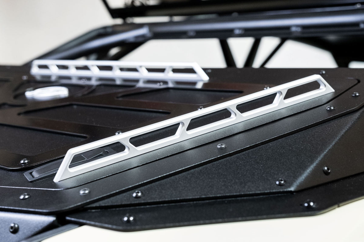 Billet aluminum handle detail on Can-Am Maverick X3 Volt Series Baja Bed Box showing machined finish