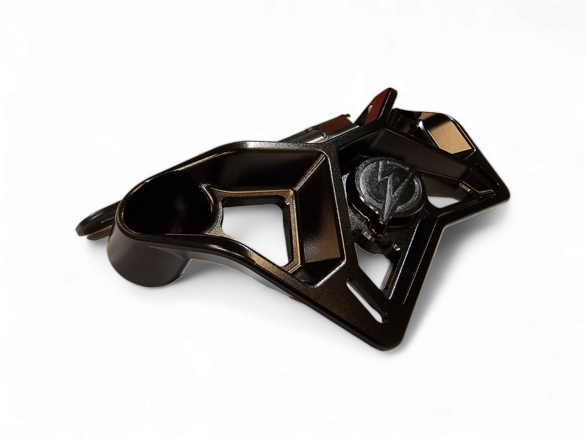 Black billet upper shock mount brace installed on Can-Am Maverick X3 reinforcing the front shock mount