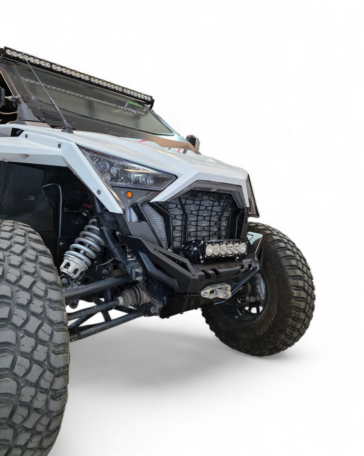 Polaris RZR Pro XP front bumper shown with lights mounted for night visibility