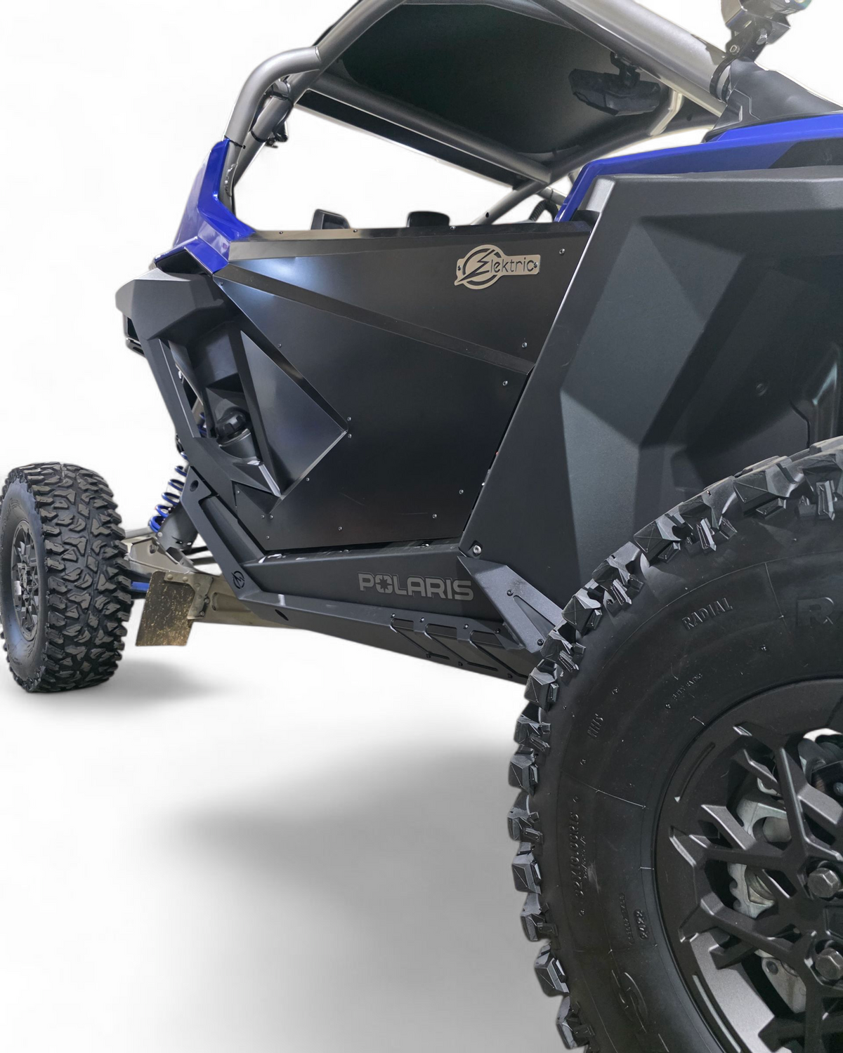 Side profile of 2-seat Polaris RZR Pro R with Volt rock sliders installed