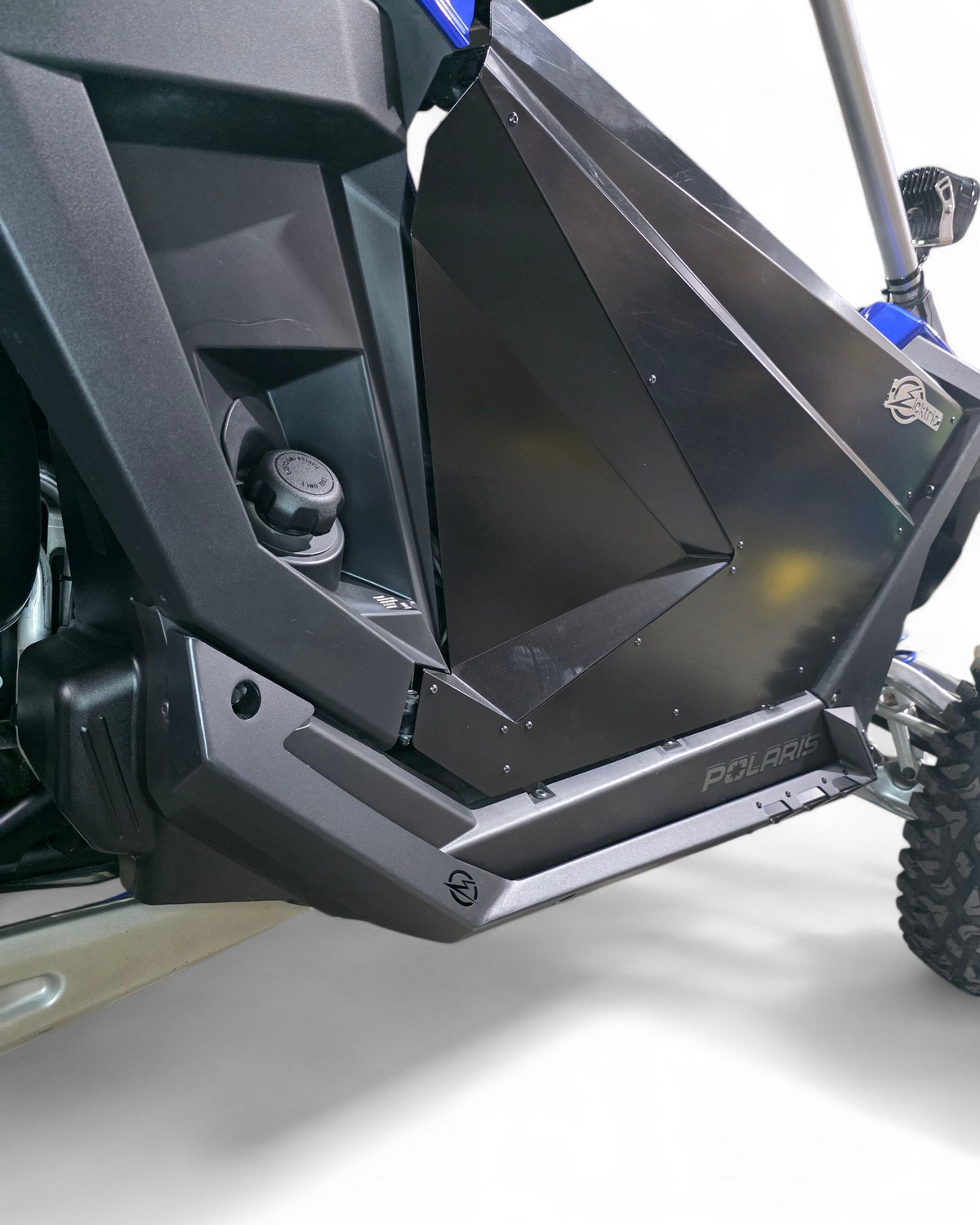Polaris RZR 2-seat rock guards shown along the frame sides in hammer black with satin panels