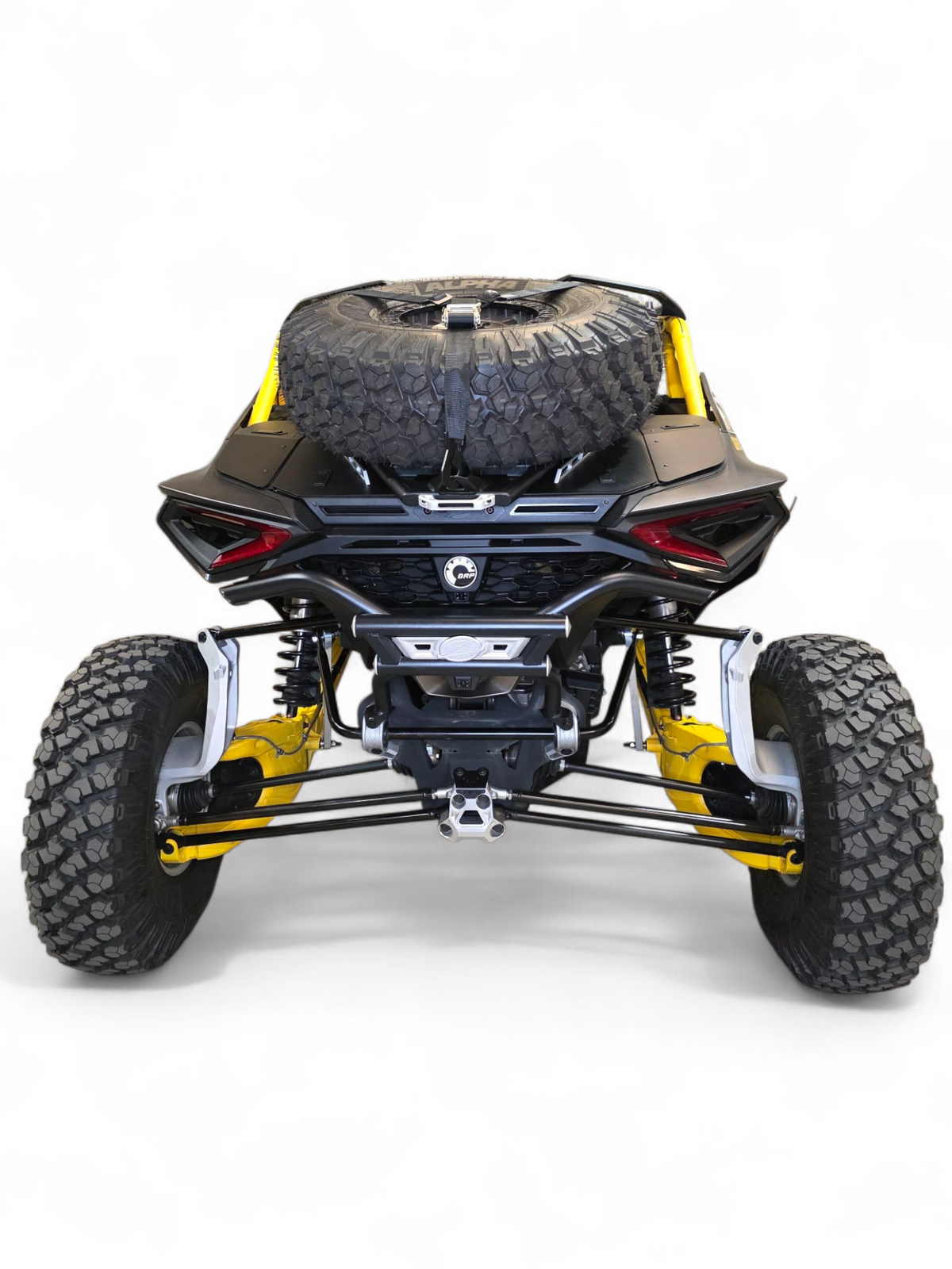 Passenger side rear quarter view of Can-Am Maverick R AMP Rear Bumper showing mounting integration