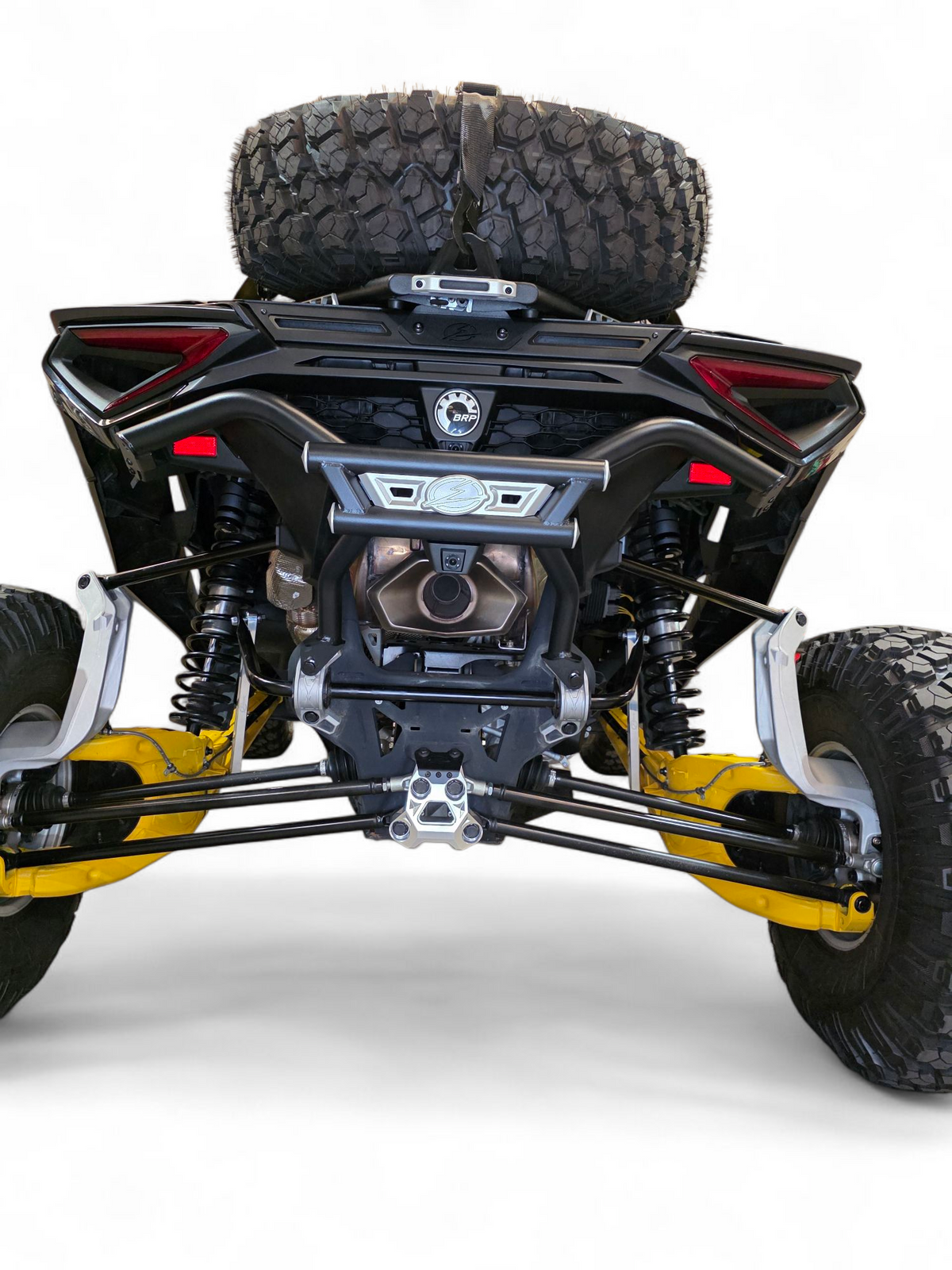 Hero shot of Can-Am Maverick R AMP Rear Bumper in weather-resistant finish on trail