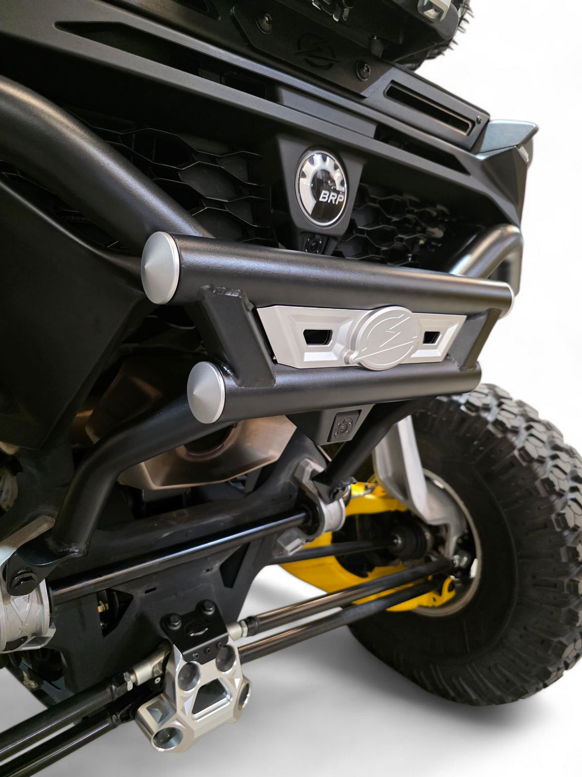 Driver side rear quarter view of AMP Rear Bumper on Can-Am Maverick R showing tubing structure