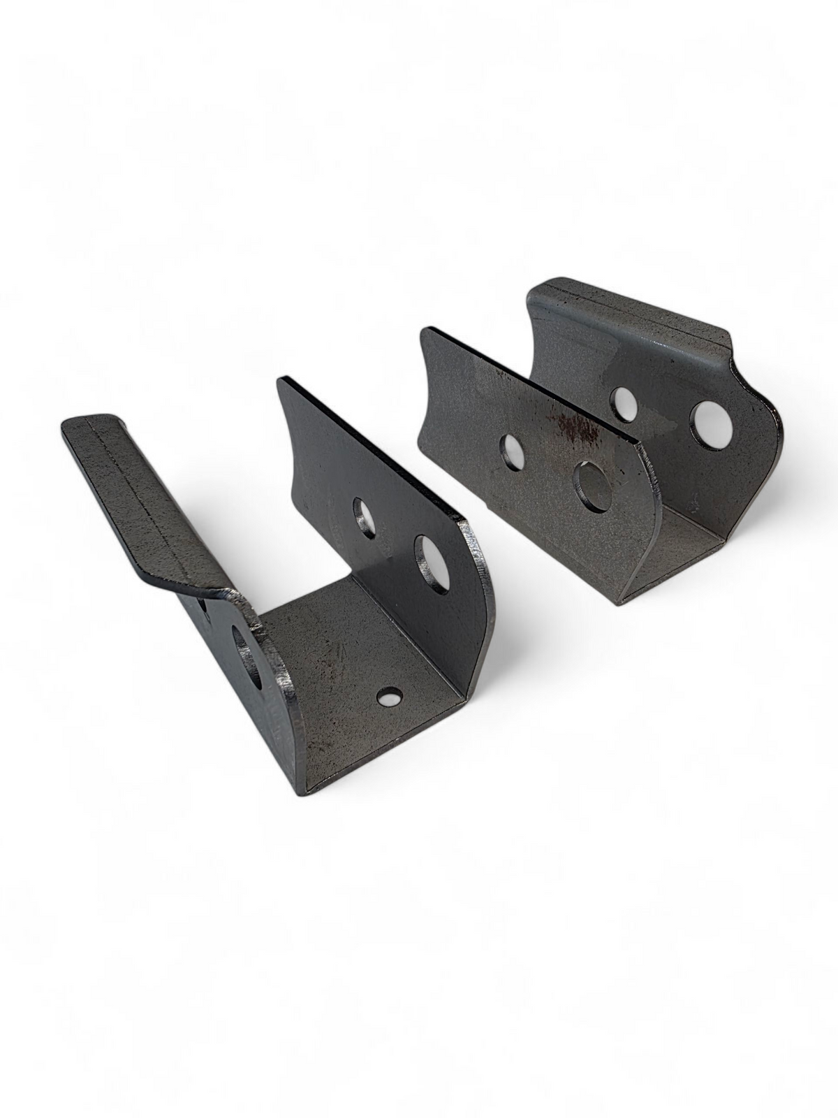 Close-up of Can-Am Maverick R trailing arm pivot gusset bracket edge profile and bolt-hole reinforcement