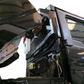 Cover plate detail concealing factory cargo light location on Polaris Ranger 1500 Headache Rack