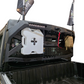 Truck bed with a white storage box and flags on a white background
