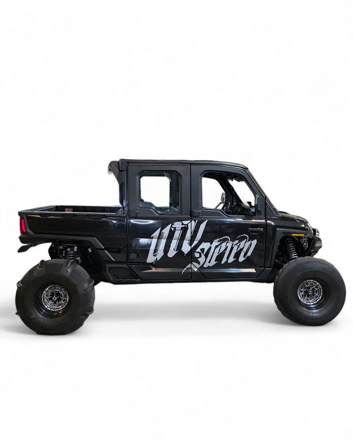 Black off-road vehicle with 'UTV Stereo' branding on a white background