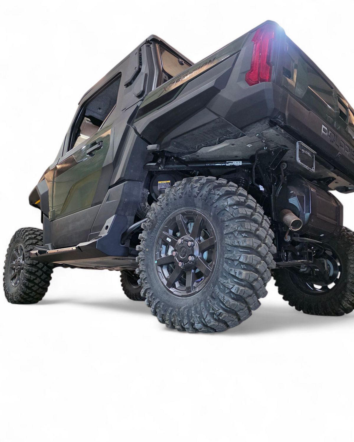 Step function shown for easier entry on tall Polaris Xpedition 2-seat rock steps