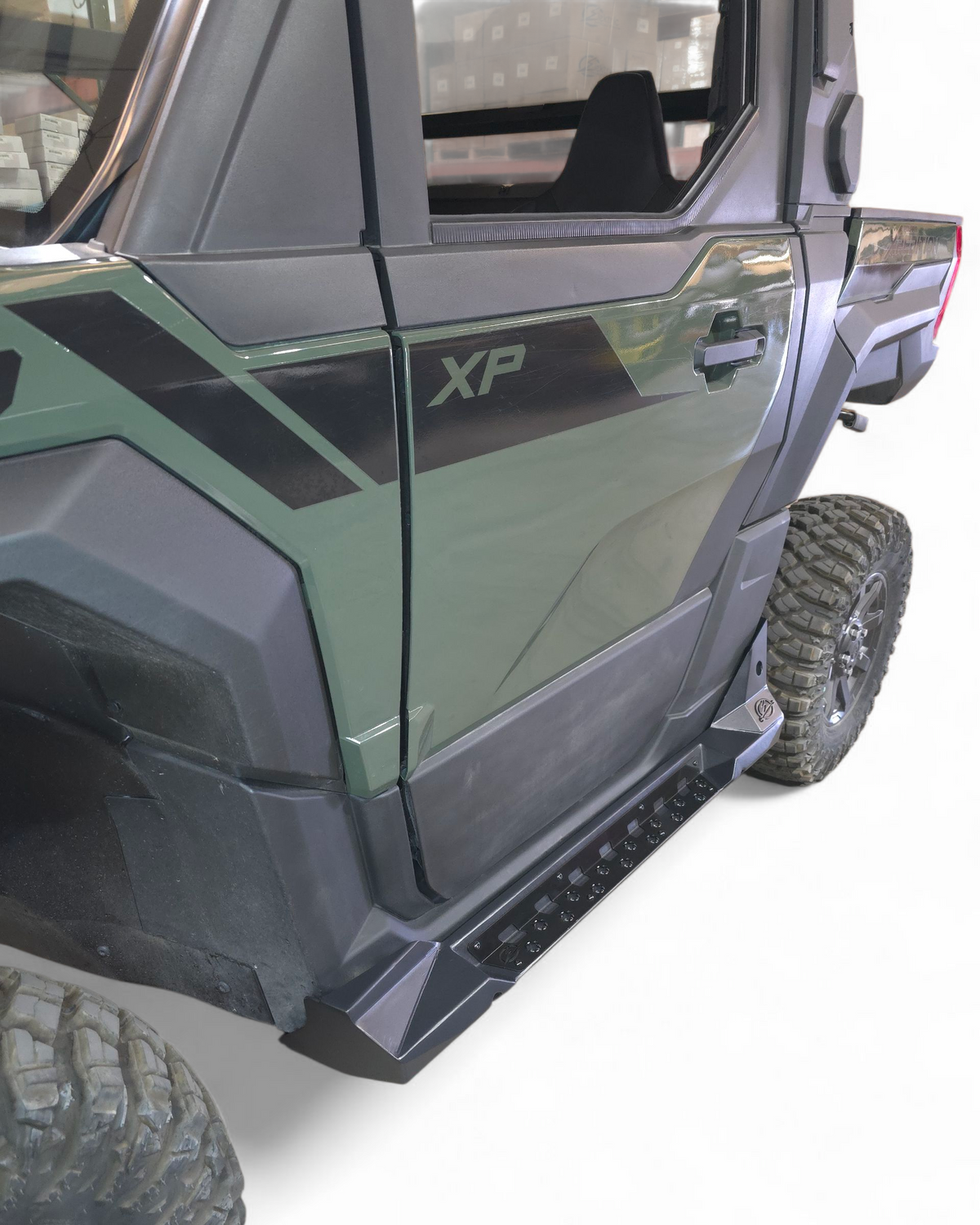 Driver side rock step installed on Polaris Xpedition 2 seat