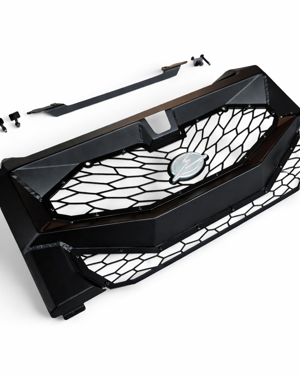 Close-up of CNC billet EOD badge on Polaris Xpedition Volt grille
