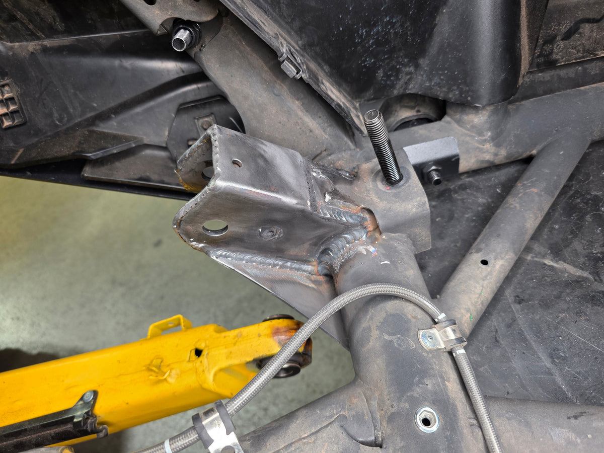 Load distribution area of Can-Am Maverick R trailing arm pivot gusset across the frame interface
