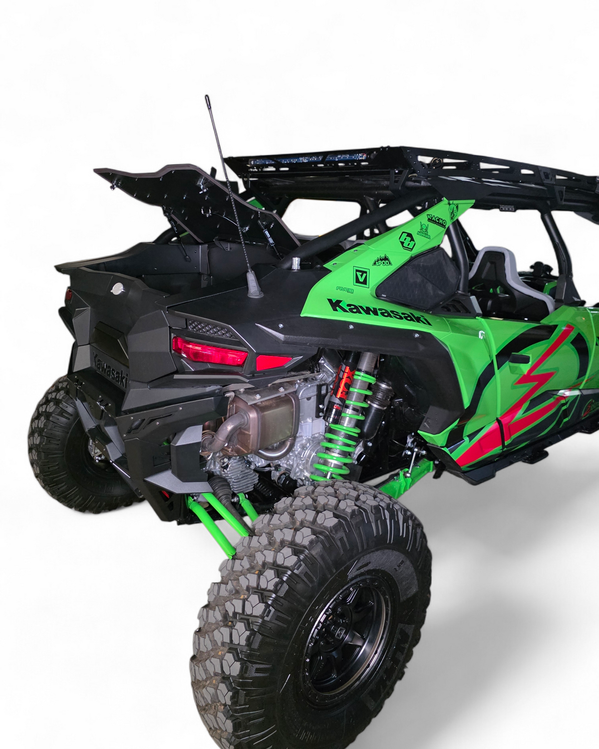 Green and black Kawasaki off-road vehicle on a white background