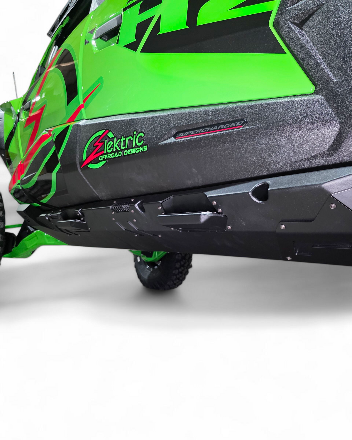 Side profile of Kawasaki Teryx H2 Volt Rock Steps showing full rocker panel coverage and aluminum panels