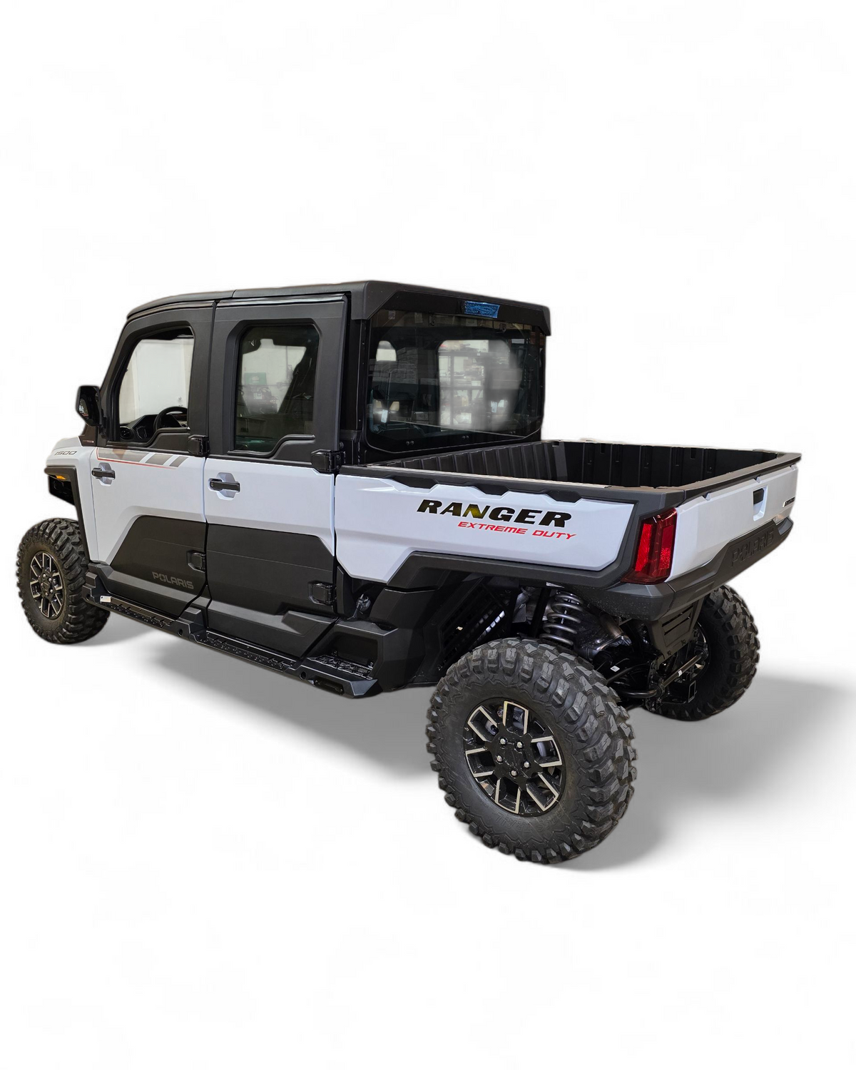 Side profile of 4-seat Polaris Ranger XD 1500 with rock sliders installed