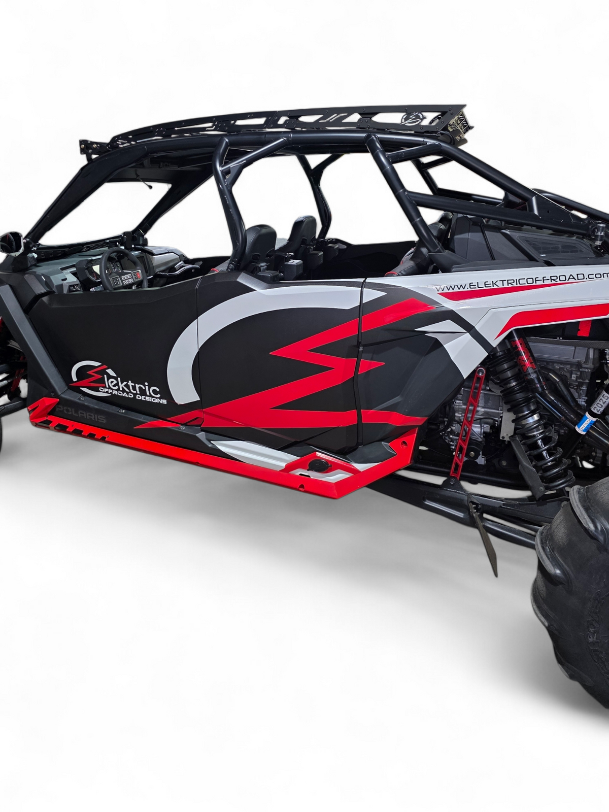 Direct front view of Polaris RZR Pro R with roof rack and front light bar mounted