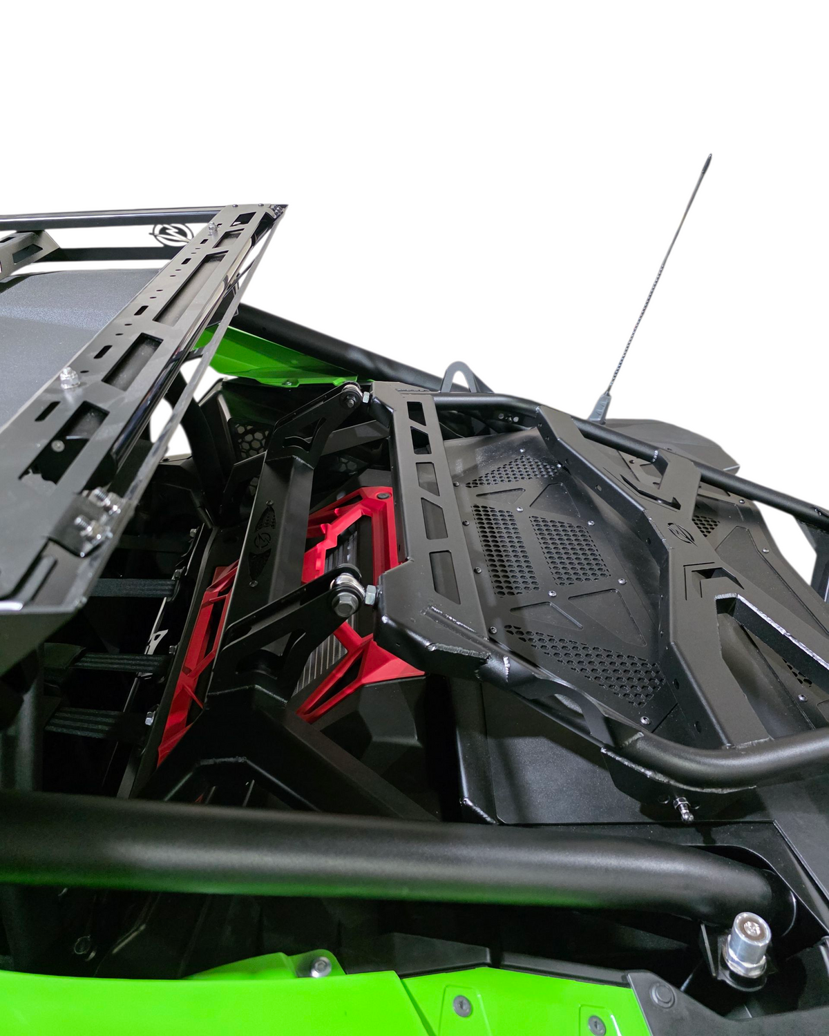 Close-up of a green vehicle's interior with black and red components on a white background