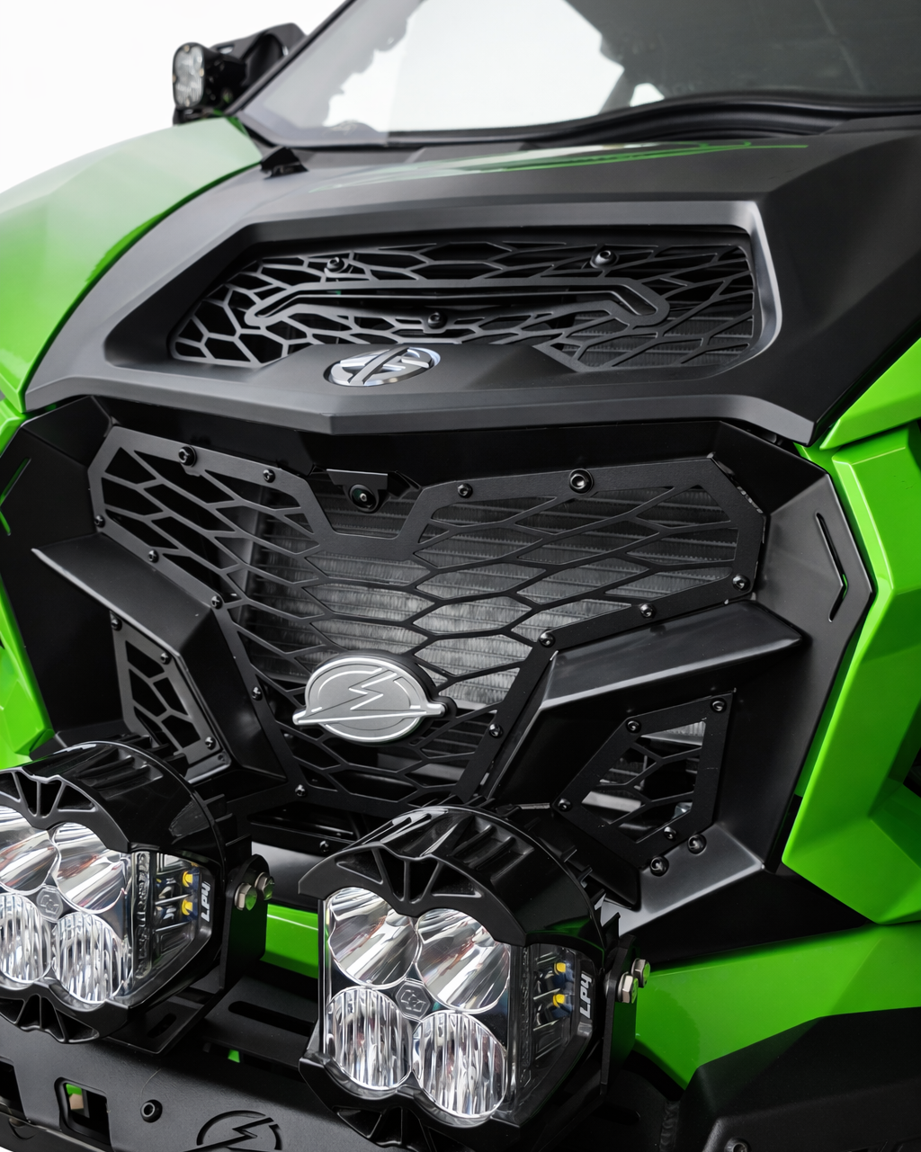 Three-piece construction detail on Kawasaki Teryx H2 Volt front grille showing airflow design