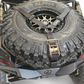 EOD Tire Y Strap shown securing an oversized off-road spare tire up to 40 inches
