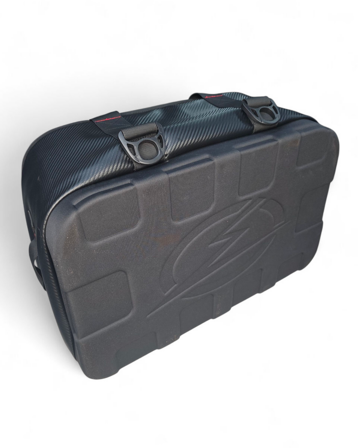 Soft cooler bag strapped into a UTV bed using tie-down points