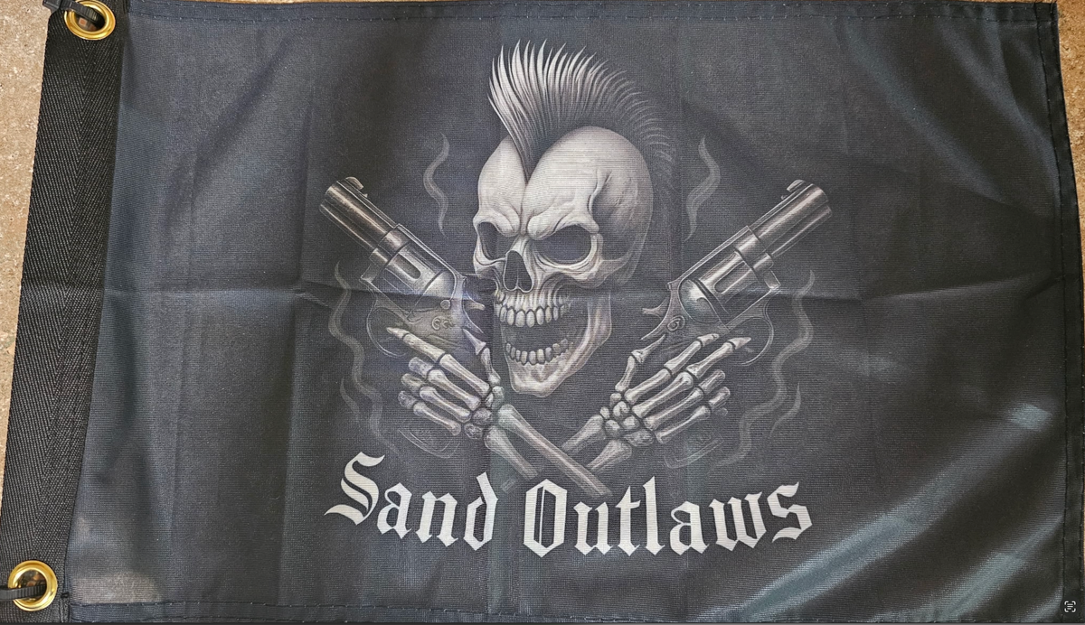 Flag with a skull holding guns and 'Sand Outlaws' text on a dark background