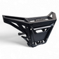 Front three-quarter view of black anodized billet winch bumper installed on Can-Am Maverick X3 showing dual light mounts