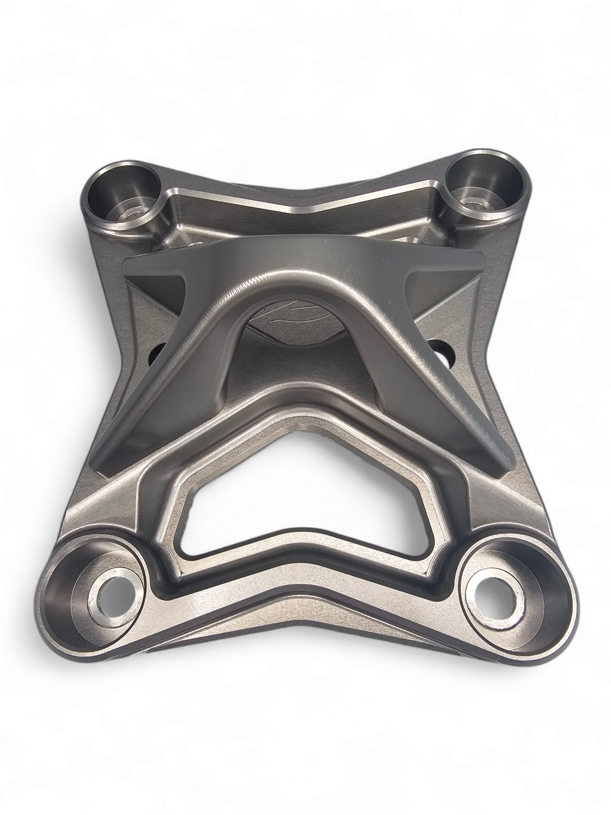 Gun metal anodized XL radius rod plate installed on Can-Am Maverick X3 protecting rear suspension heim joints