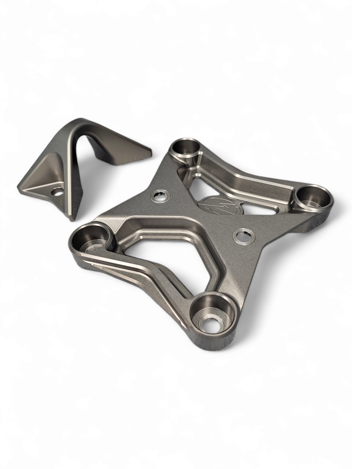 Built-in tow hook detail on Can-Am Maverick X3 gun metal billet radius rod plate for recovery