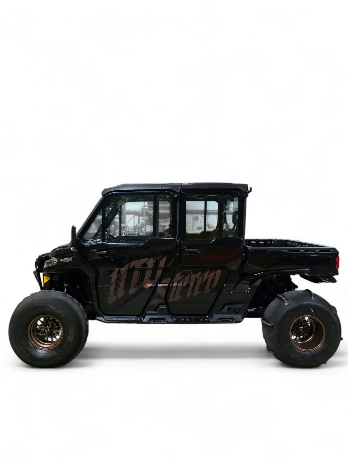 Full machine side view of 4-seat Can-Am Defender fitted with Volt Rock Steps