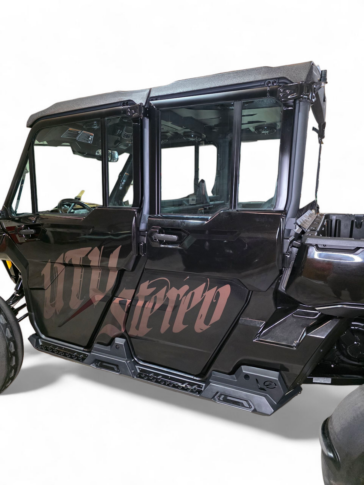 Built-in step with grip plating detail on Can-Am Defender Volt Rock Steps for traction
