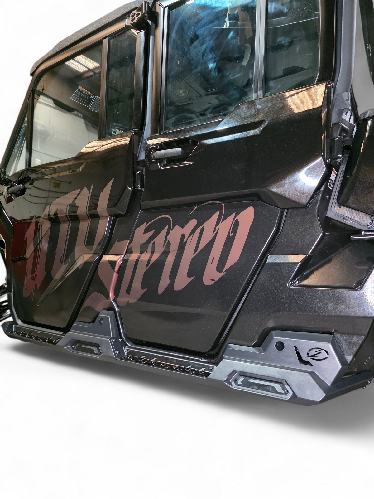 Steel slider and satin black aluminum accent plate detail on Can-Am Defender Volt Rock Steps