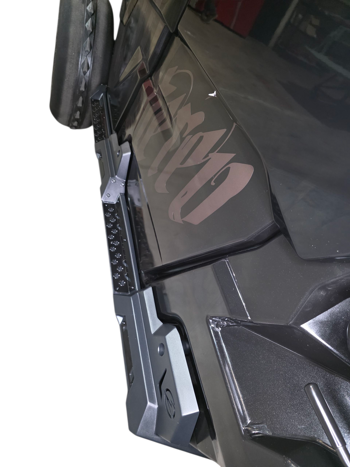 Driver side Volt Rock Steps installed on 4-seat Can-Am Defender showing frame protection