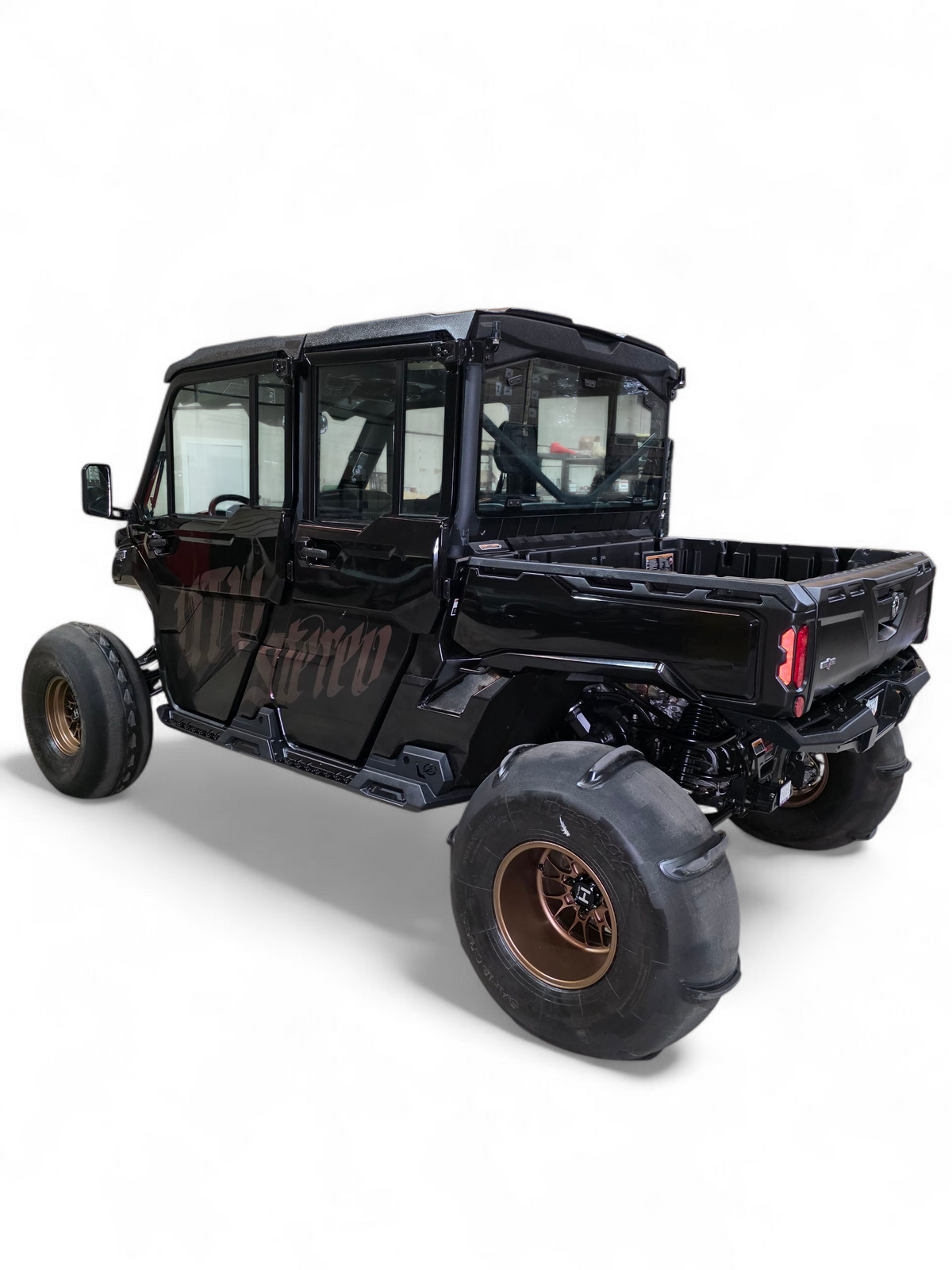 Passenger side Volt Rock Steps on 4-seat Can-Am Defender showing body protection and step