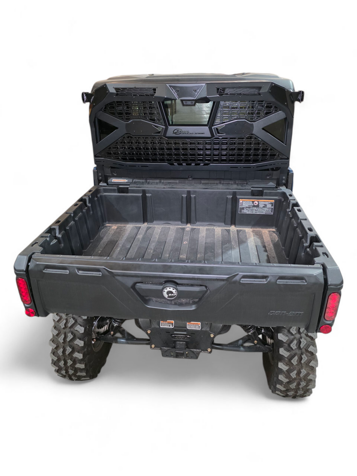 Light and whip mounts on Can-Am Defender Headache Rack for rear visibility