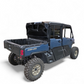 Can-Am Defender bed tilted with Headache Rack installed showing preserved bed function