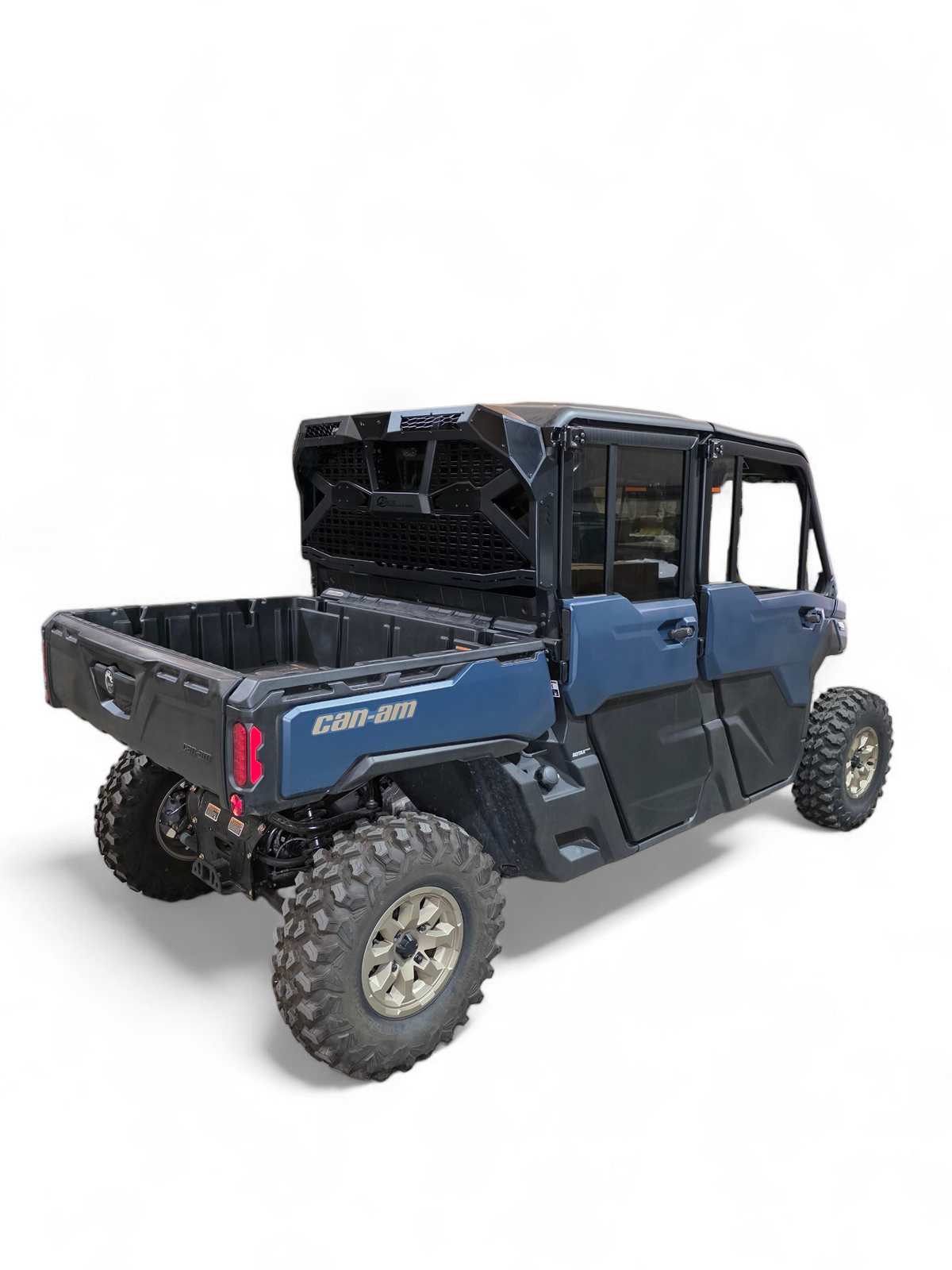 Can-Am Defender bed tilted with Headache Rack installed showing preserved bed function