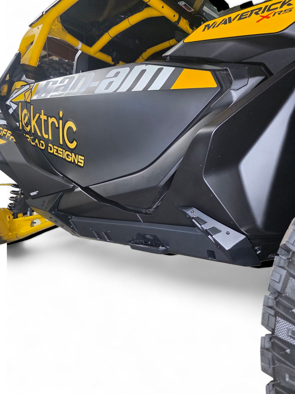 Volt Rocker Steps installed on 2-seat Can-Am Maverick R showing steel rock slider protection and built-in step