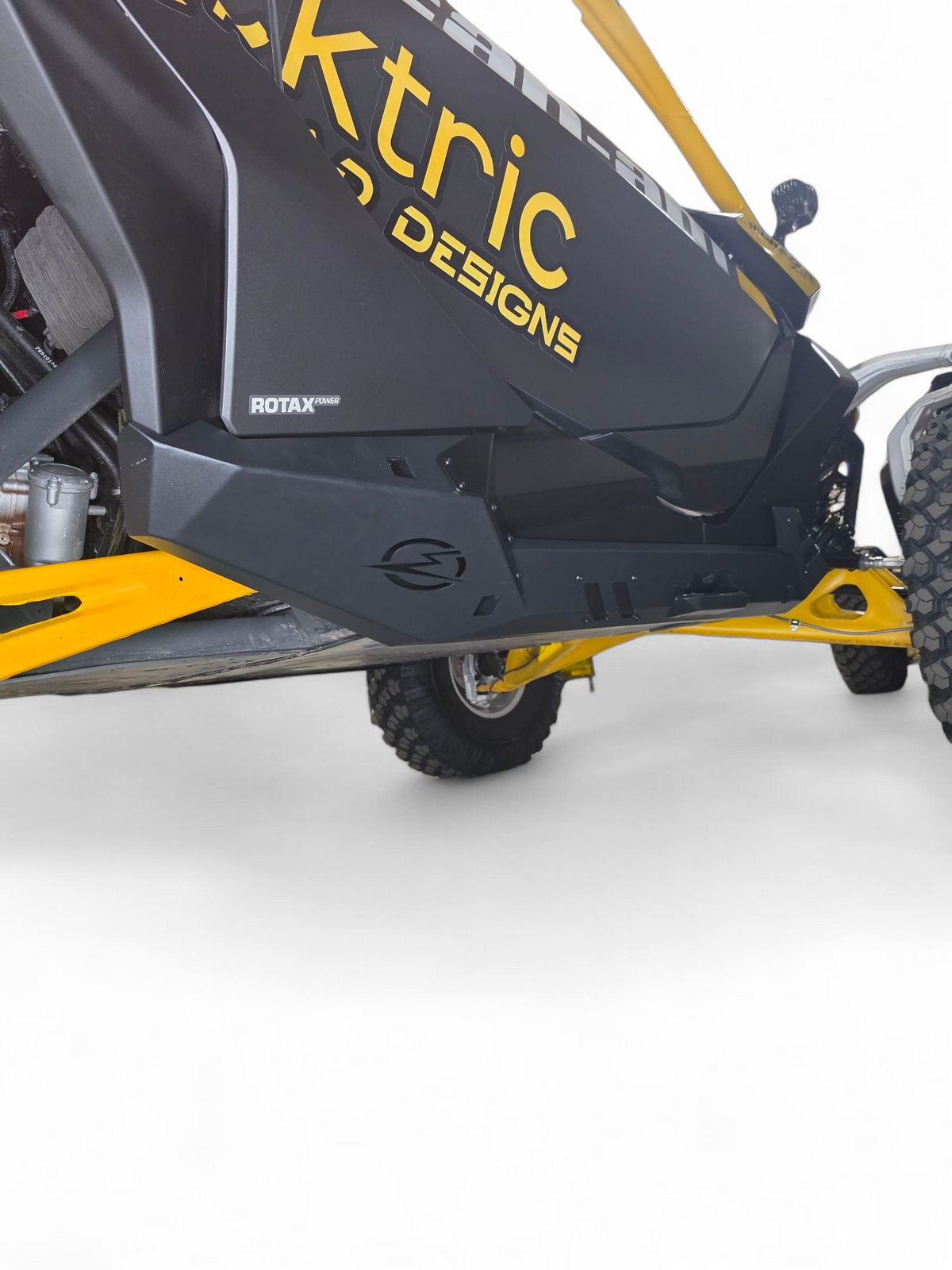 Built-in step with grip plating detail on Can-Am Maverick R 2-seat Volt Rocker Steps for traction