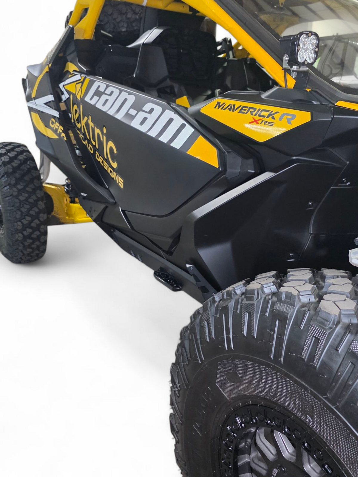 Driver side Volt Rocker Steps installed on 2-seat Can-Am Maverick R showing frame side protection