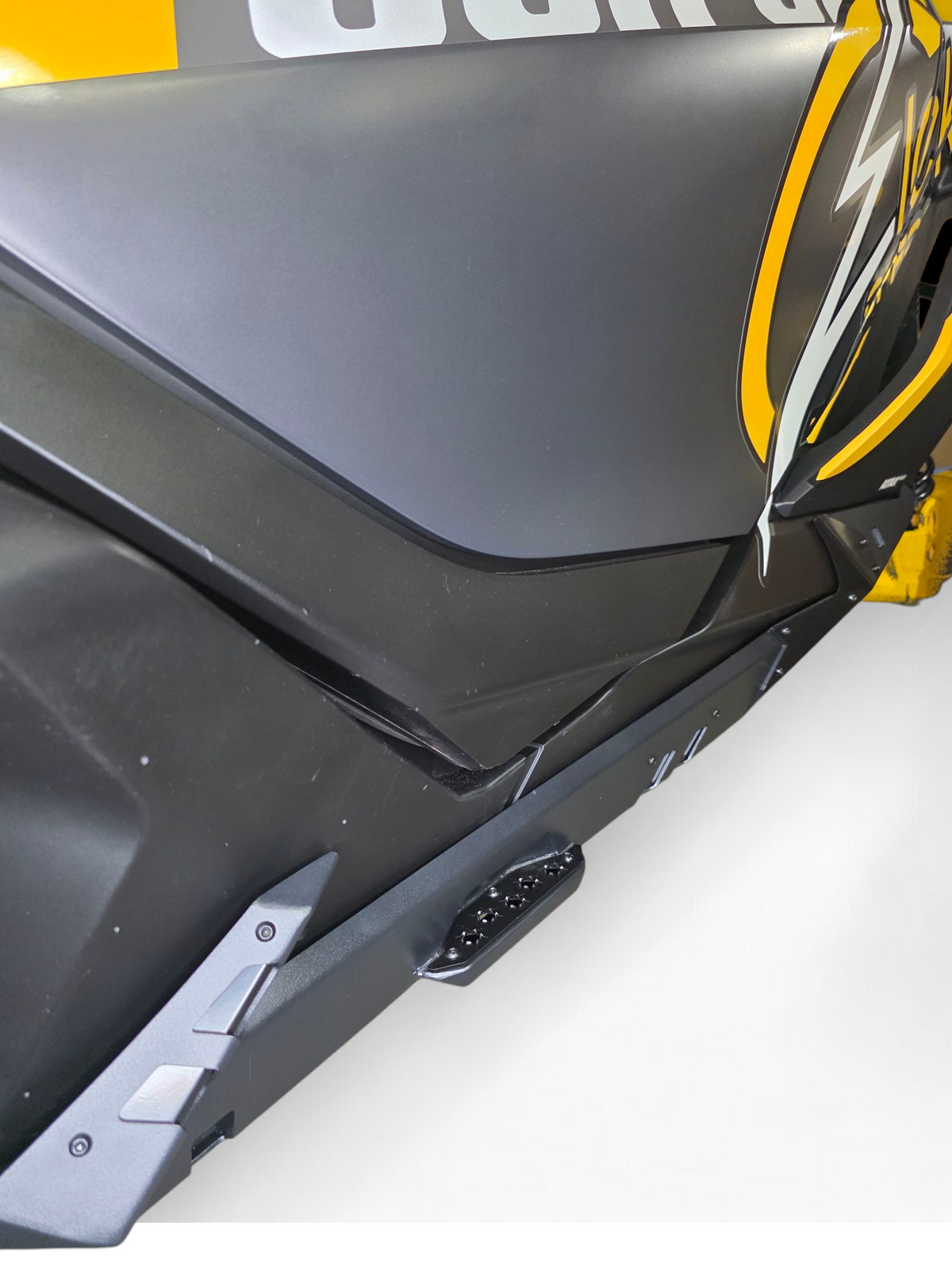 Grip plating traction surface close-up on Can-Am Maverick R Volt Rocker Steps step function