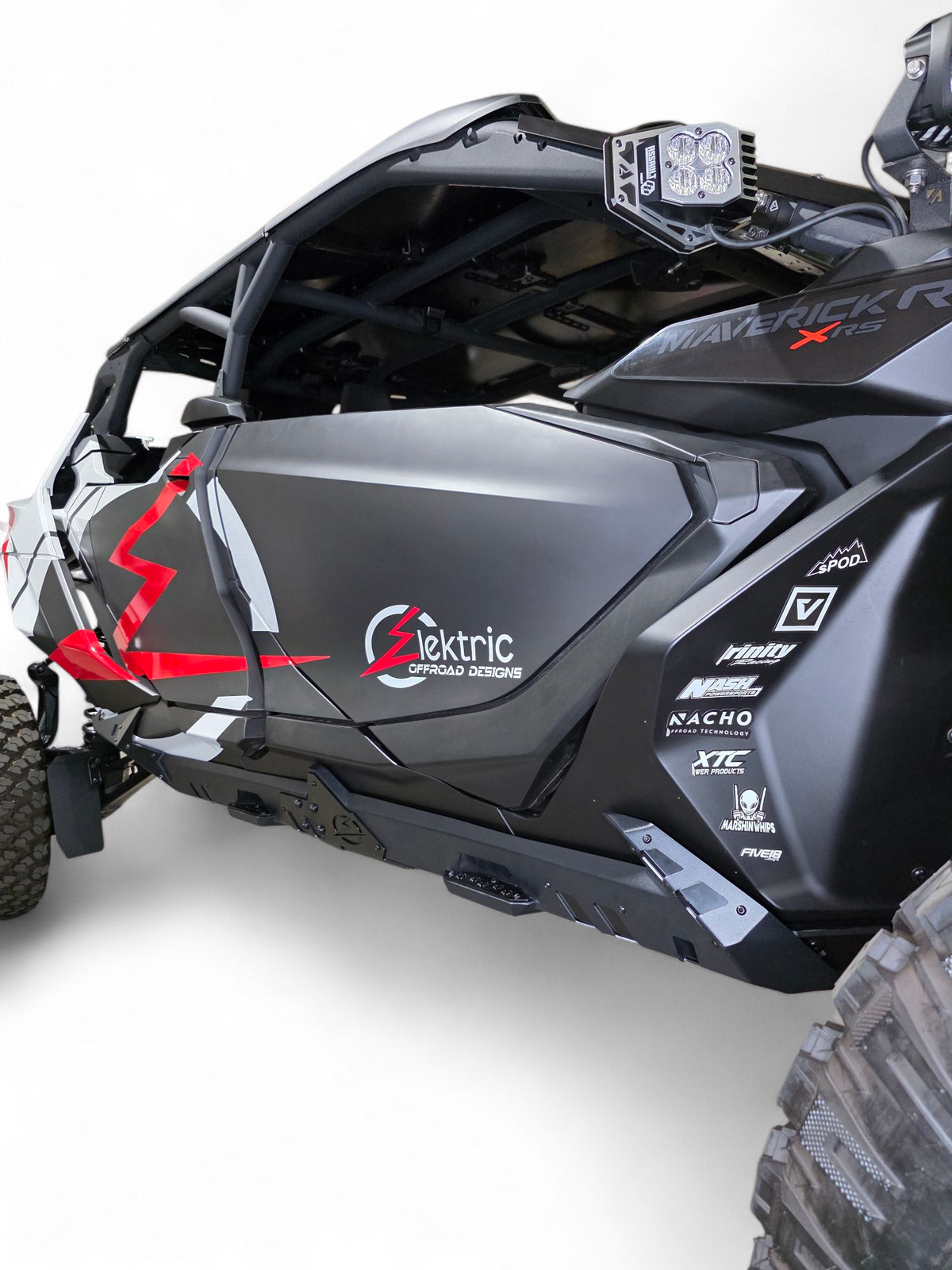 Volt Rocker Steps installed on 4-seat Can-Am Maverick R showing steel rock slider protection and built-in step